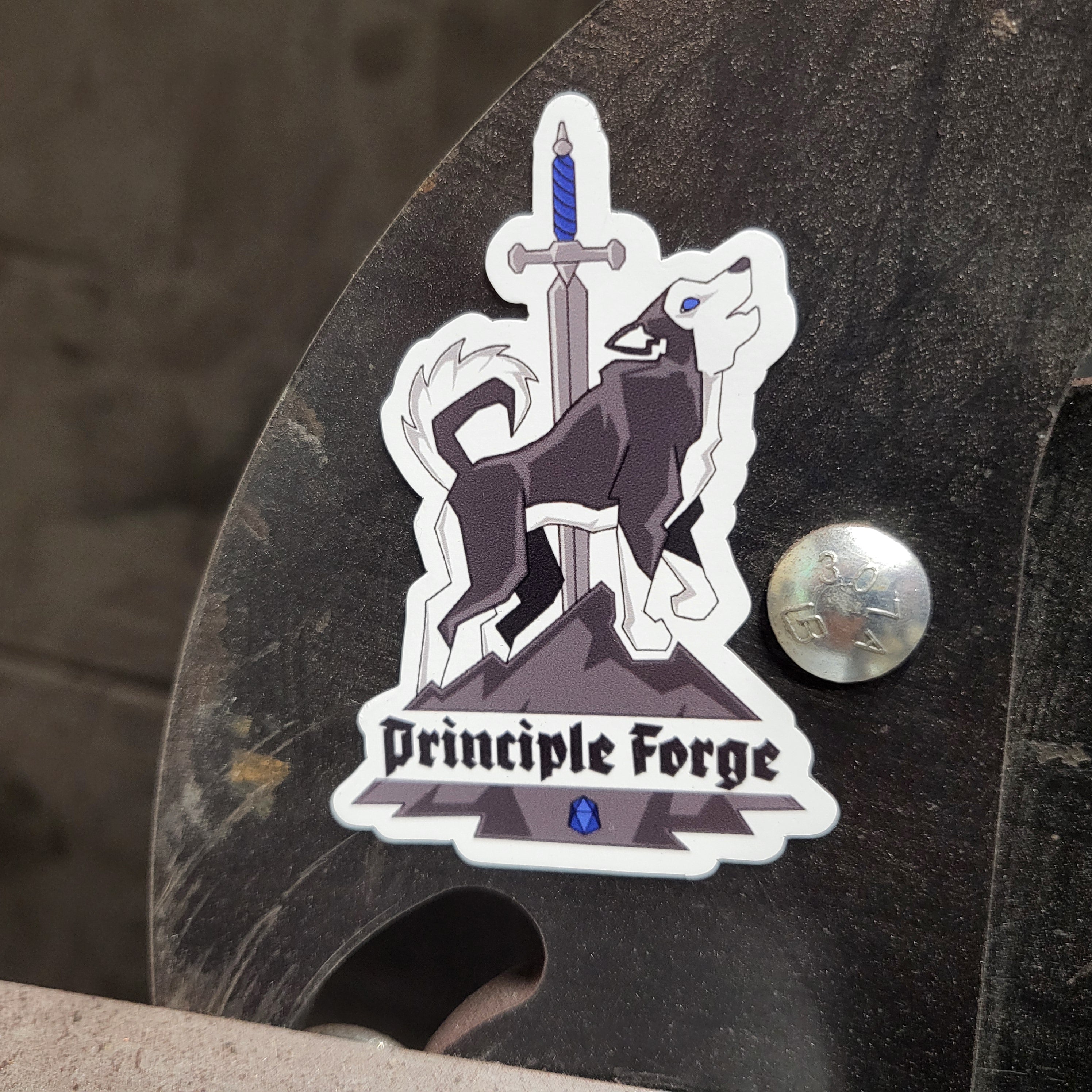 Magnet of the Principle Forge logo featuring a husky on a mountain with a sword and the words 'Principle Forge'