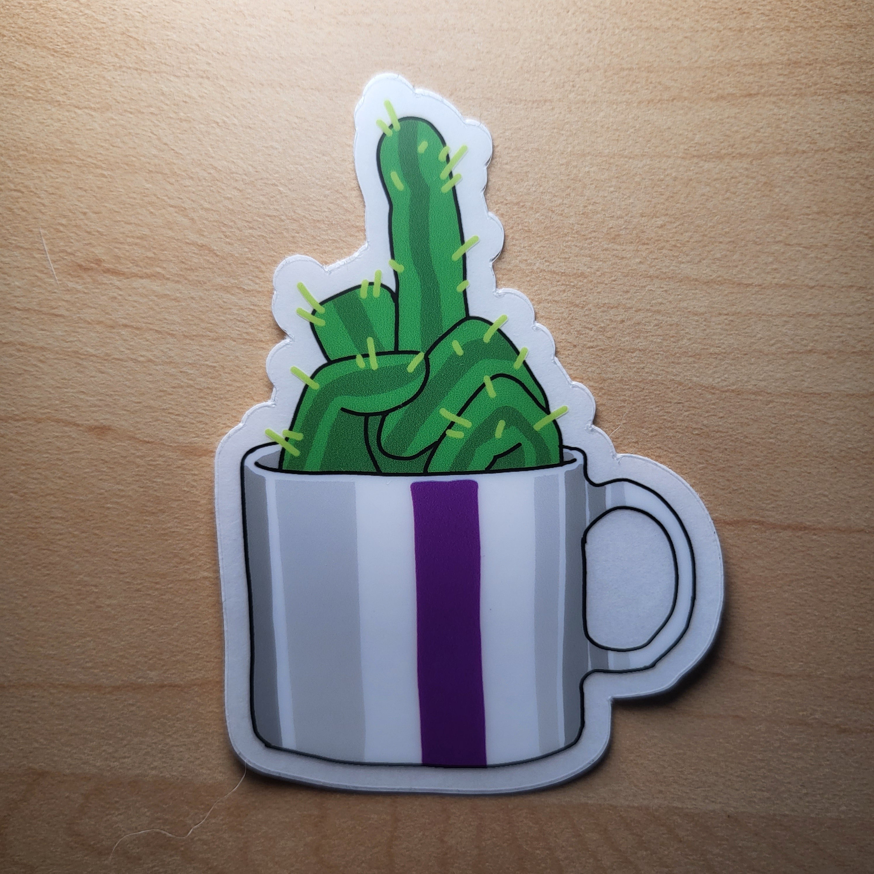 Sticker of a cactus in a cup on a wooden surface
