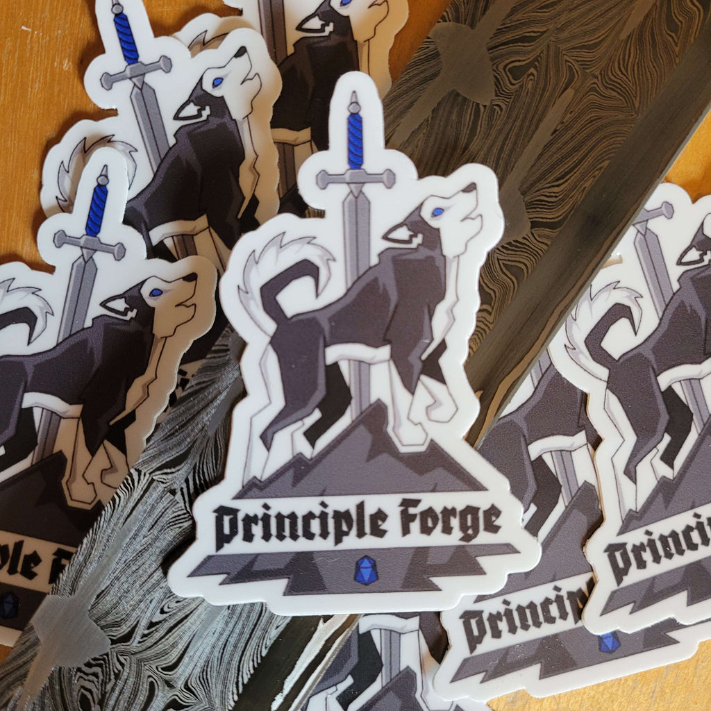 Sticker of the Principle Forge logo featuring a husky on a mountain with a sword and the words 'Principle Forge' sitting on a Damascus blade