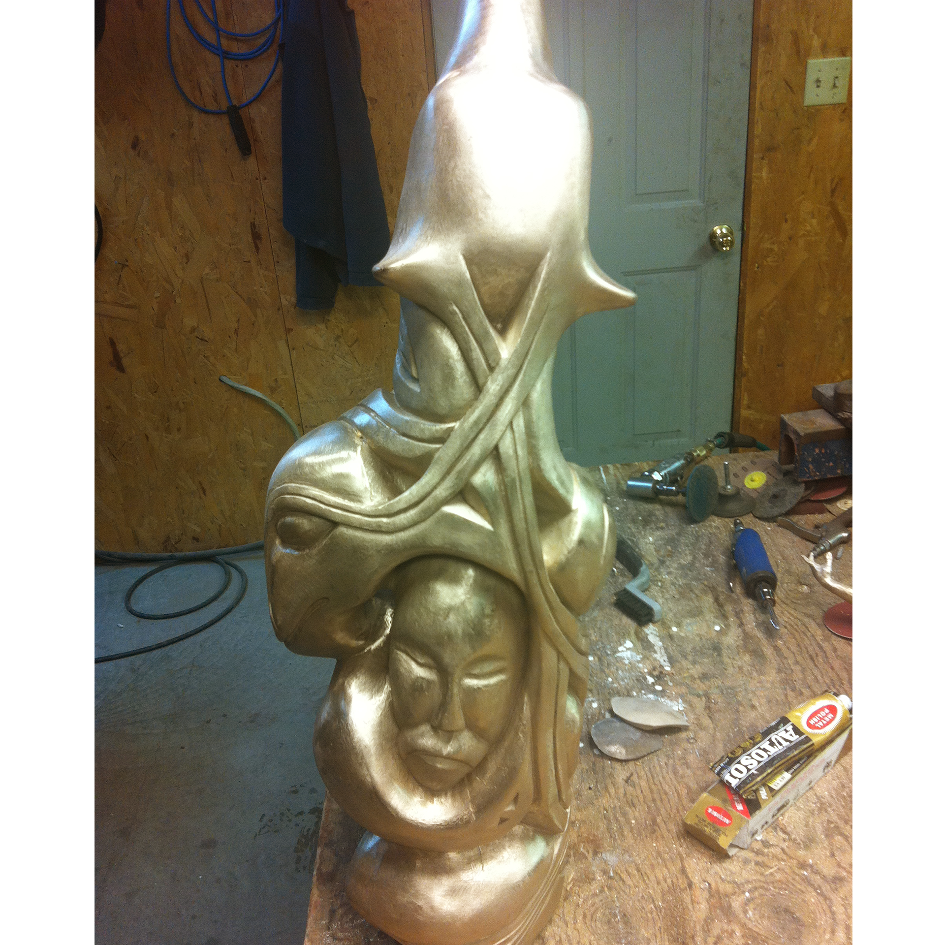 Bronze sculpture recreation of a bear in a workshop setting