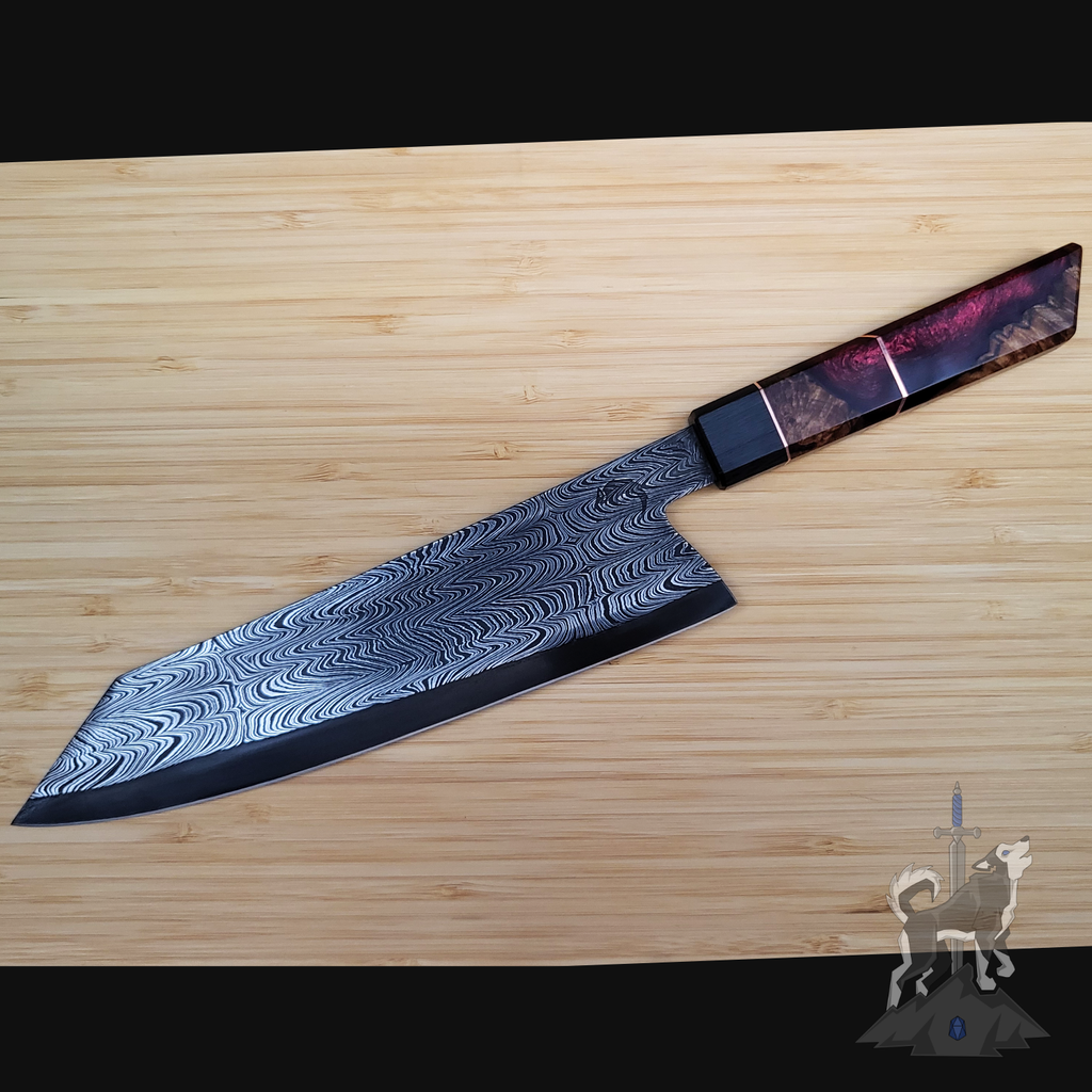 Damascus chef knife on a wooden cutting board.