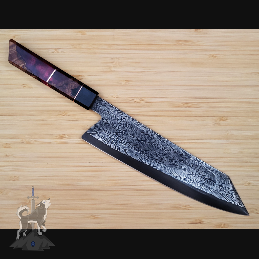 Damascus chef knife on a wooden cutting board.