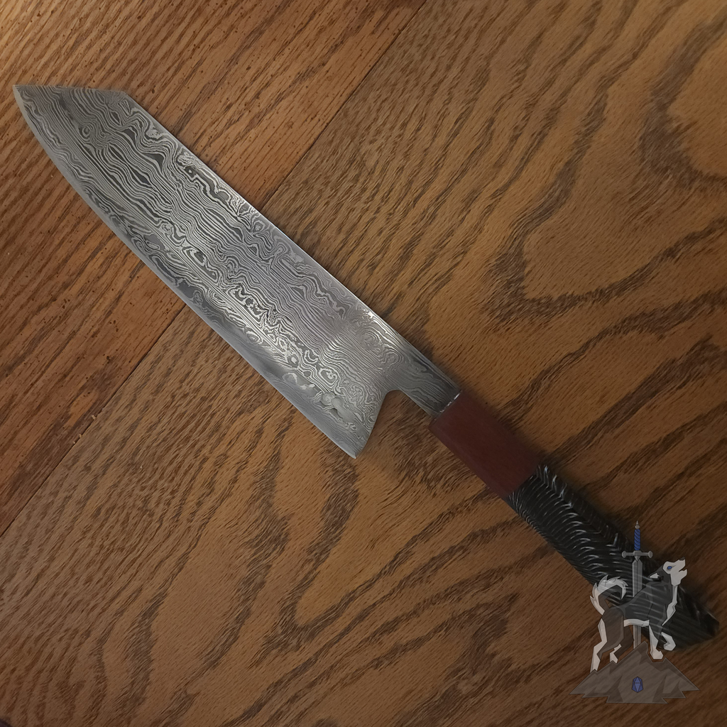 Chef knife with Damascus pattern on a dark wooden surface.