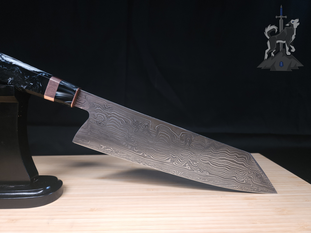 A Damascus chef's knife on a stand on a wooden cutting board with a black background