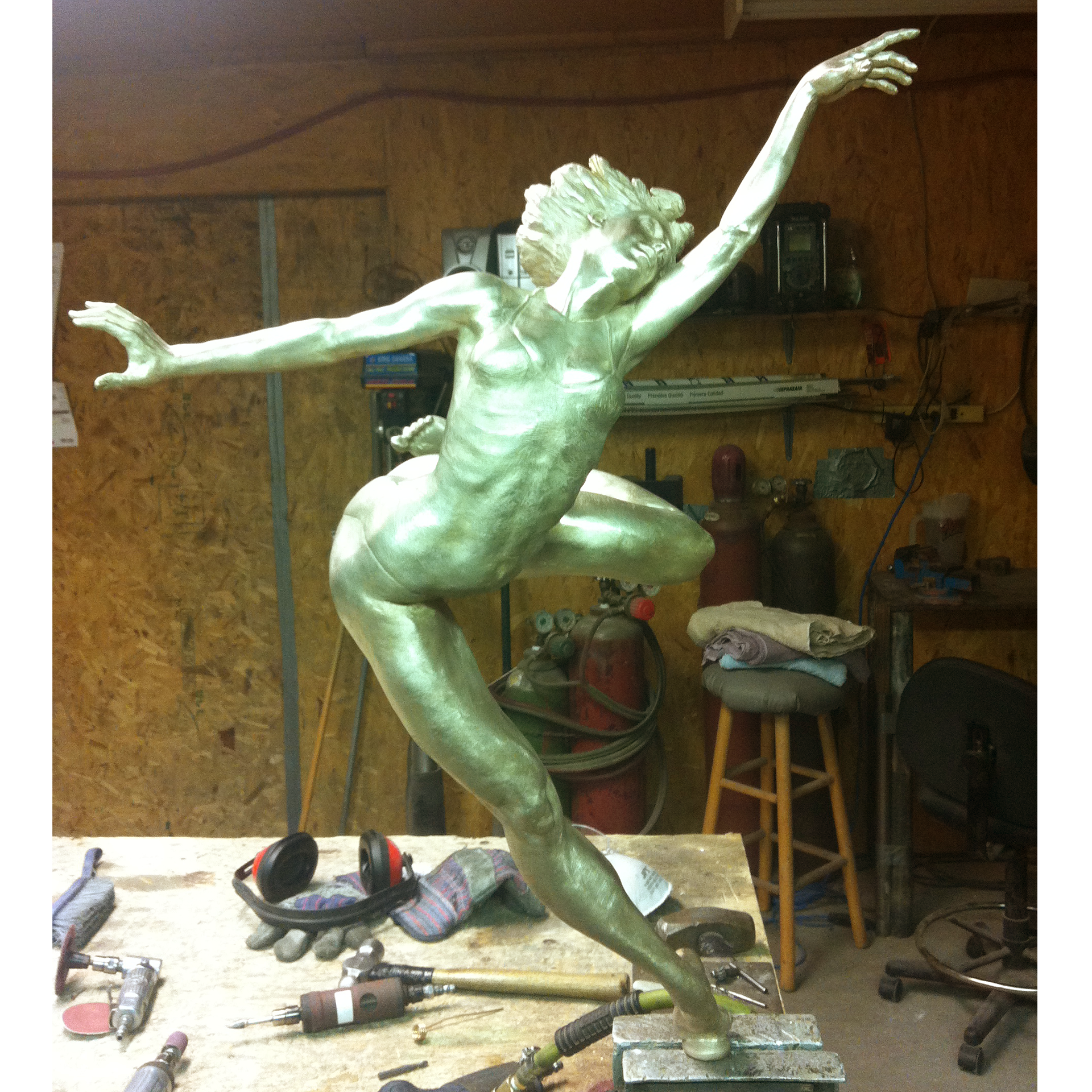 Bronze sculpture recreation of dancers in a workshop setting