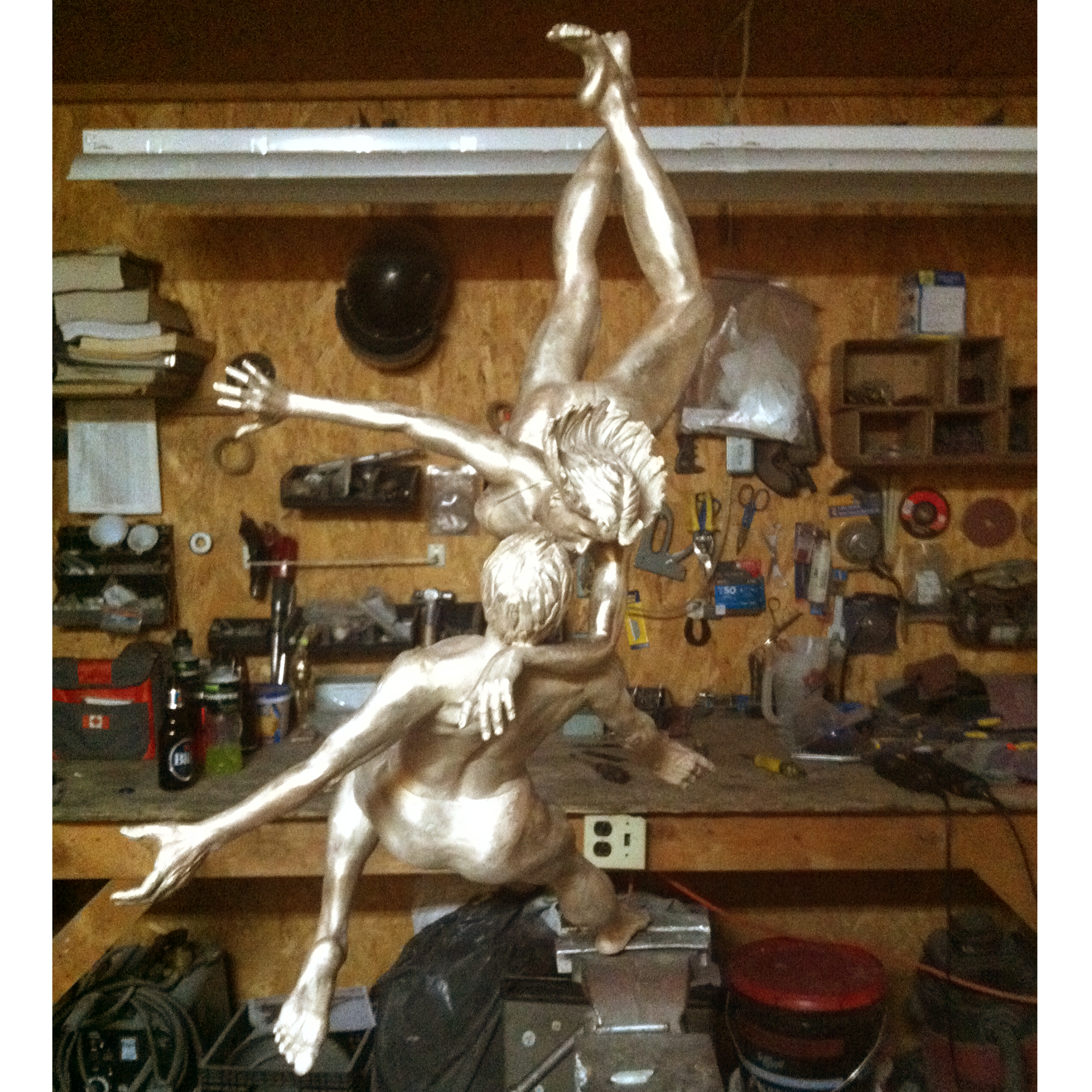 Bronze sculpture recreation of dancers in a workshop setting