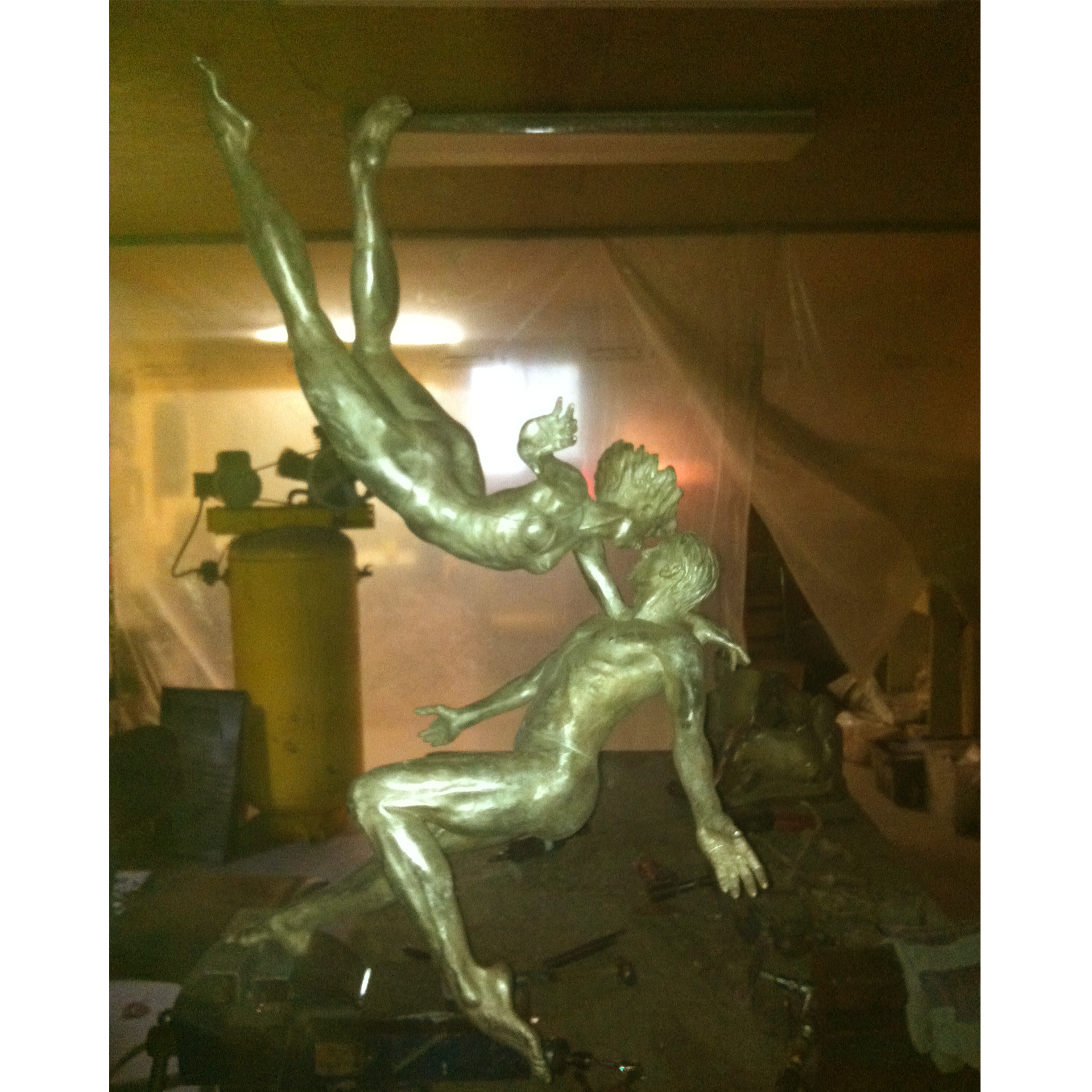 Bronze sculpture recreation of dancers in a workshop setting