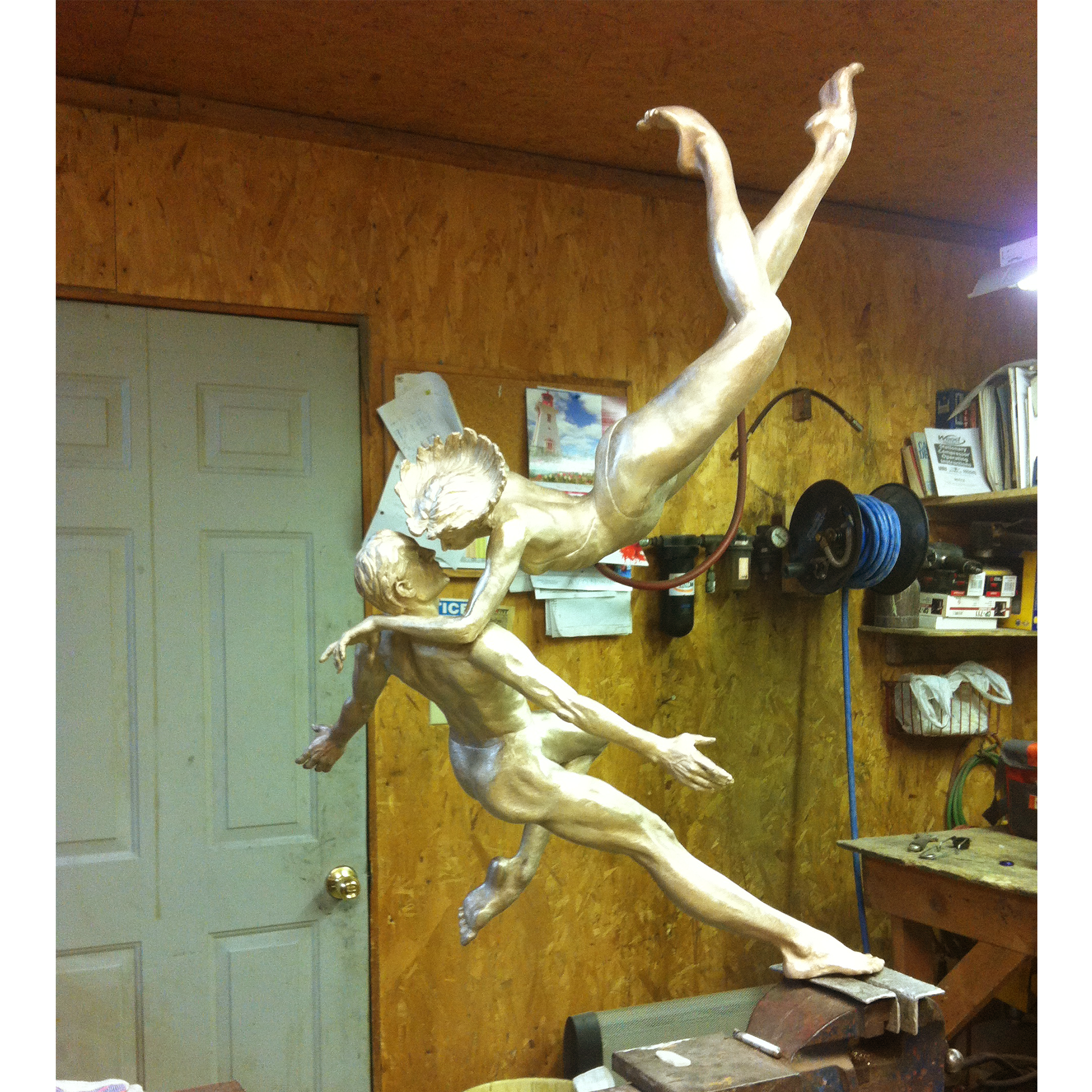 Bronze sculpture recreation of dancers in a workshop setting