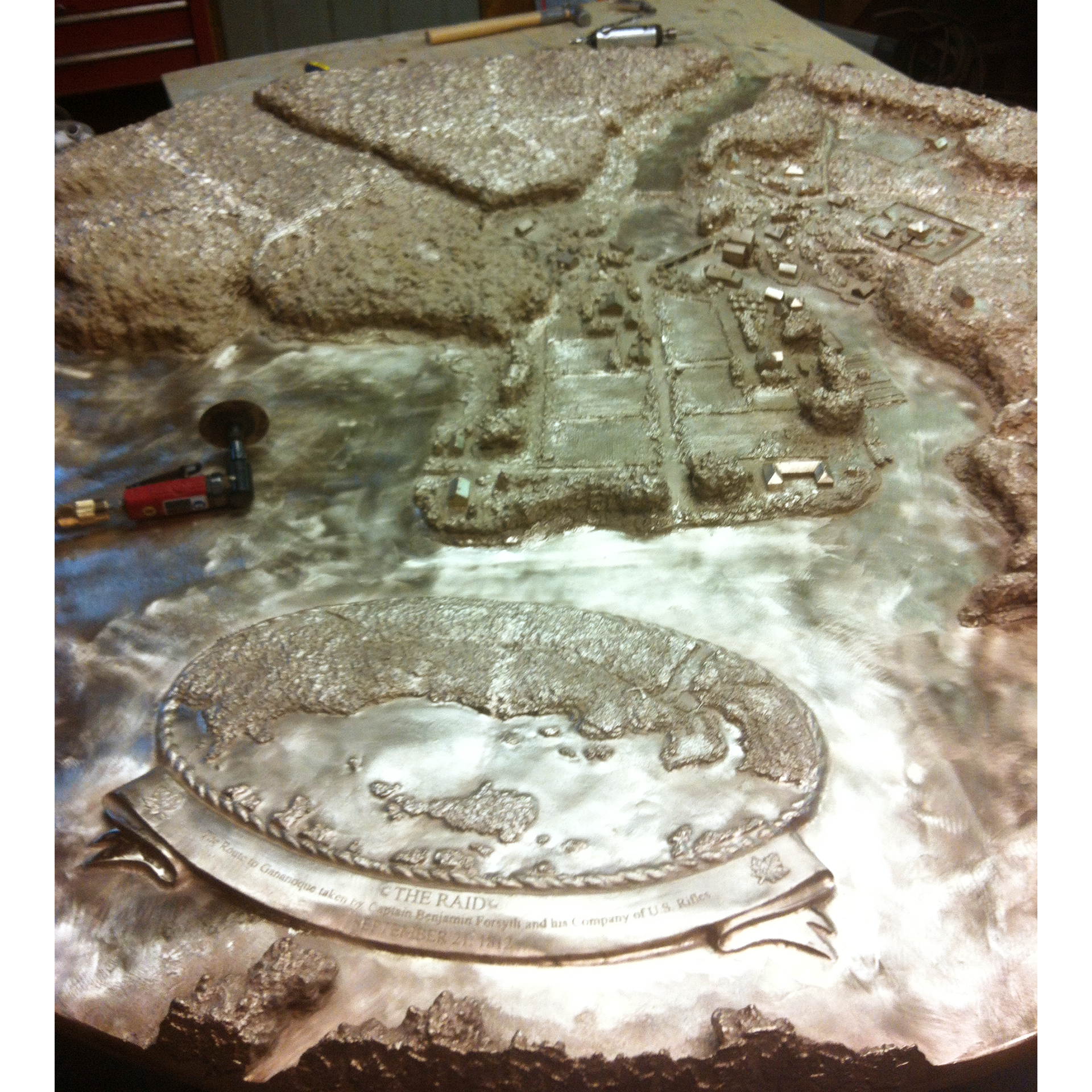 Bronze casting of Fort Gananoque circa 1812 in a workshop setting