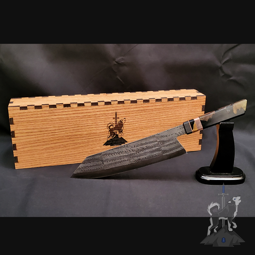 Chef knife with Damascus pattern on a stand next to a wooden box on a dark background